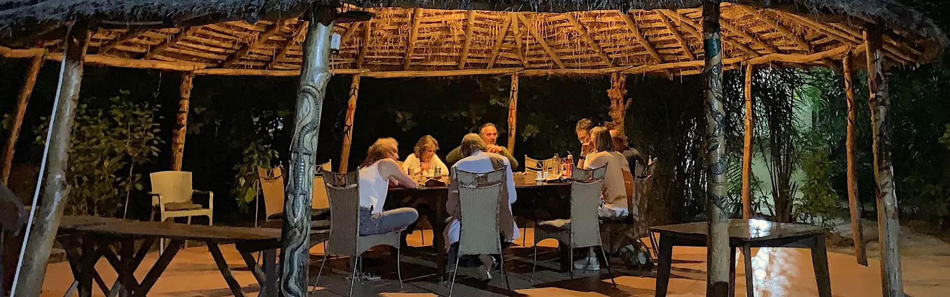 a group of people sitting around a table