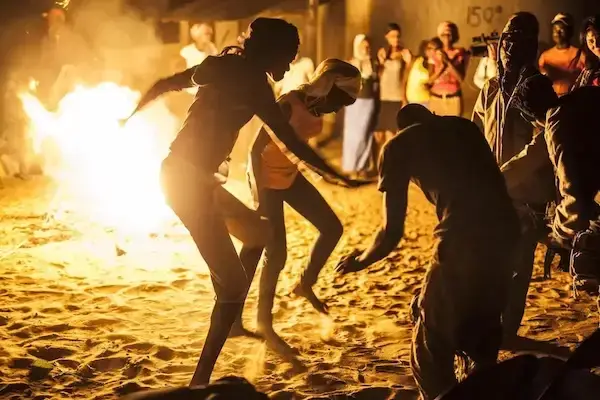 Dancing around a fire in Gambia